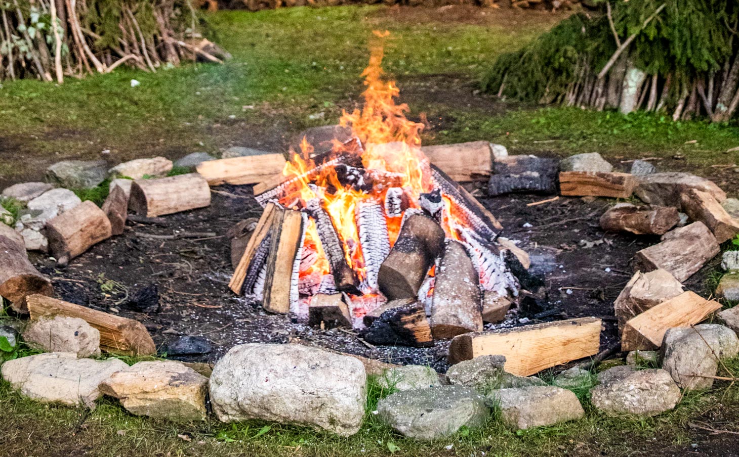 A campfire in a pit.