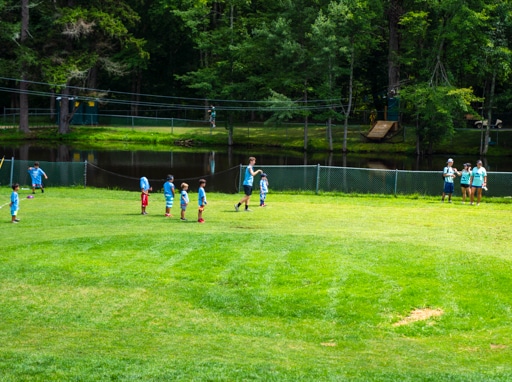 Campers playing soccer on the soccer fields.