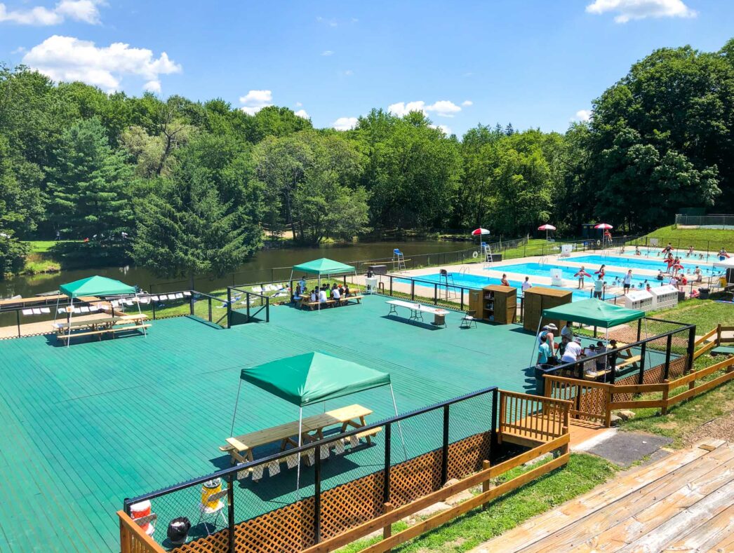 An aerial view of the pool, lake, and picnic areas on the Breezemont Campus.