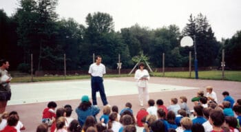 Campers listening during a camp assembly.