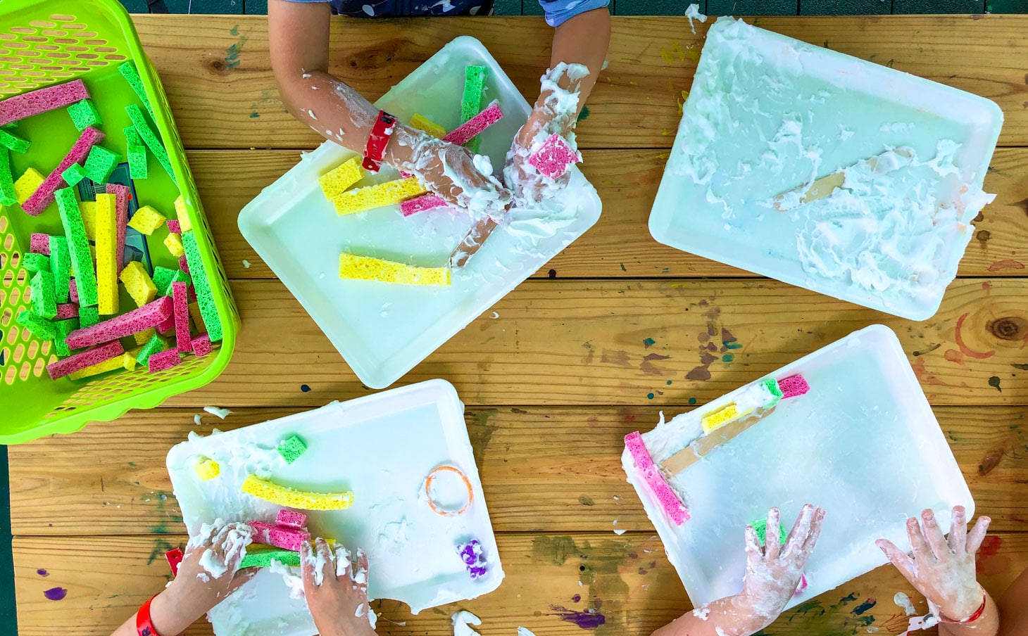 Campers making messy art work and having fun.