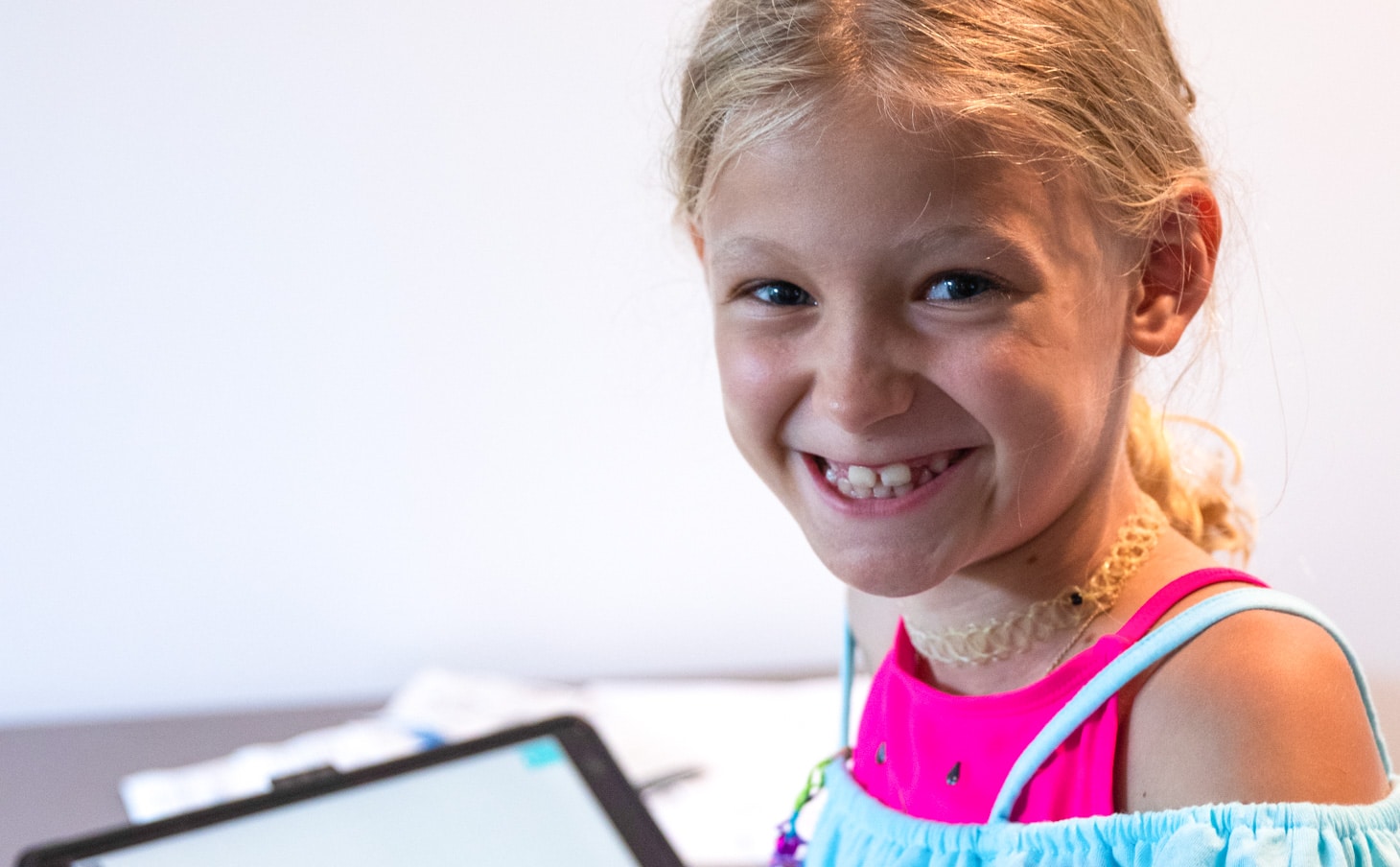 A camper smiling after signing in.