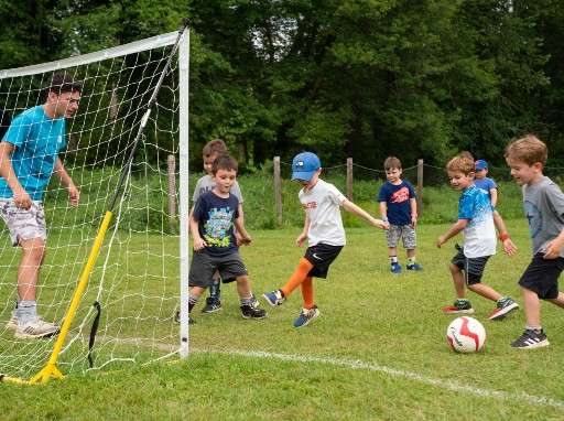 Campers playing soccer on the soccer fields.